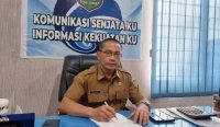 Kadis Kominfo Kabupaten Asahan Syamsuddin, SH, MM di ruang kerjanya, Senin (30/01/2023). (doc/Kominfo/diksimerdeka.com)