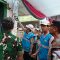 Petugas PLN bersama Bupati Jember dan jajaran TNI-Polri meresmikan penyalaan listrik perdana di Dusun Bandealit, Desa Andongrejo, Kecamatan Tempurejo, Sabtu (16/8/2025).