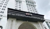 Alt Text: Gedung Otoritas Jasa Keuangan di Jakarta terkait penegakan hukum kasus BPR Duta Niaga Pontianak.