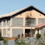 Petugas keamanan berjaga di depan asrama yang rusak akibat kebakaran di Utumishi Girls Academy, Gilgil, Kenya.